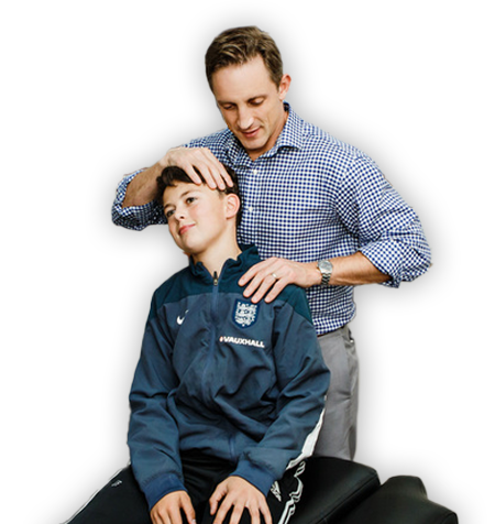 Chiropractor Victoria BC Cale Copeland Adjusting Young Patient