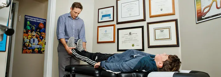 Chiropractor Victoria BC Cale Copeland With Patient Stretching